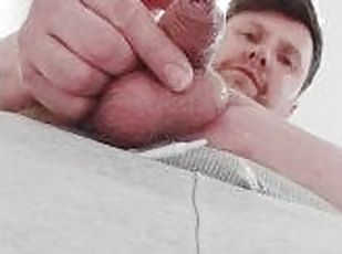 Close up pissing from uncut cock.