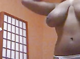 Busty black stripping on webcam