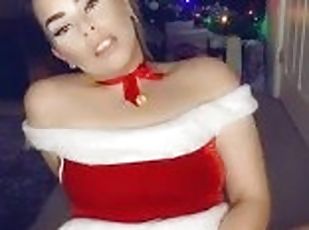 Slutty Santa plays with pierced pussy