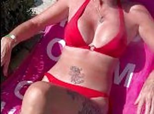 Sunbathing bikini milf