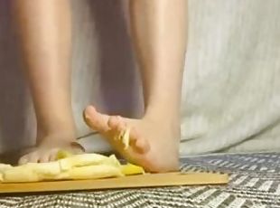 Crushing a banana between toes
