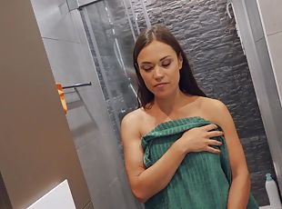 Dark-haired babe opens ass to get anal orgasm in bathroom