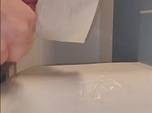 0.25 Slow-motion of public bathroom cum into sink.